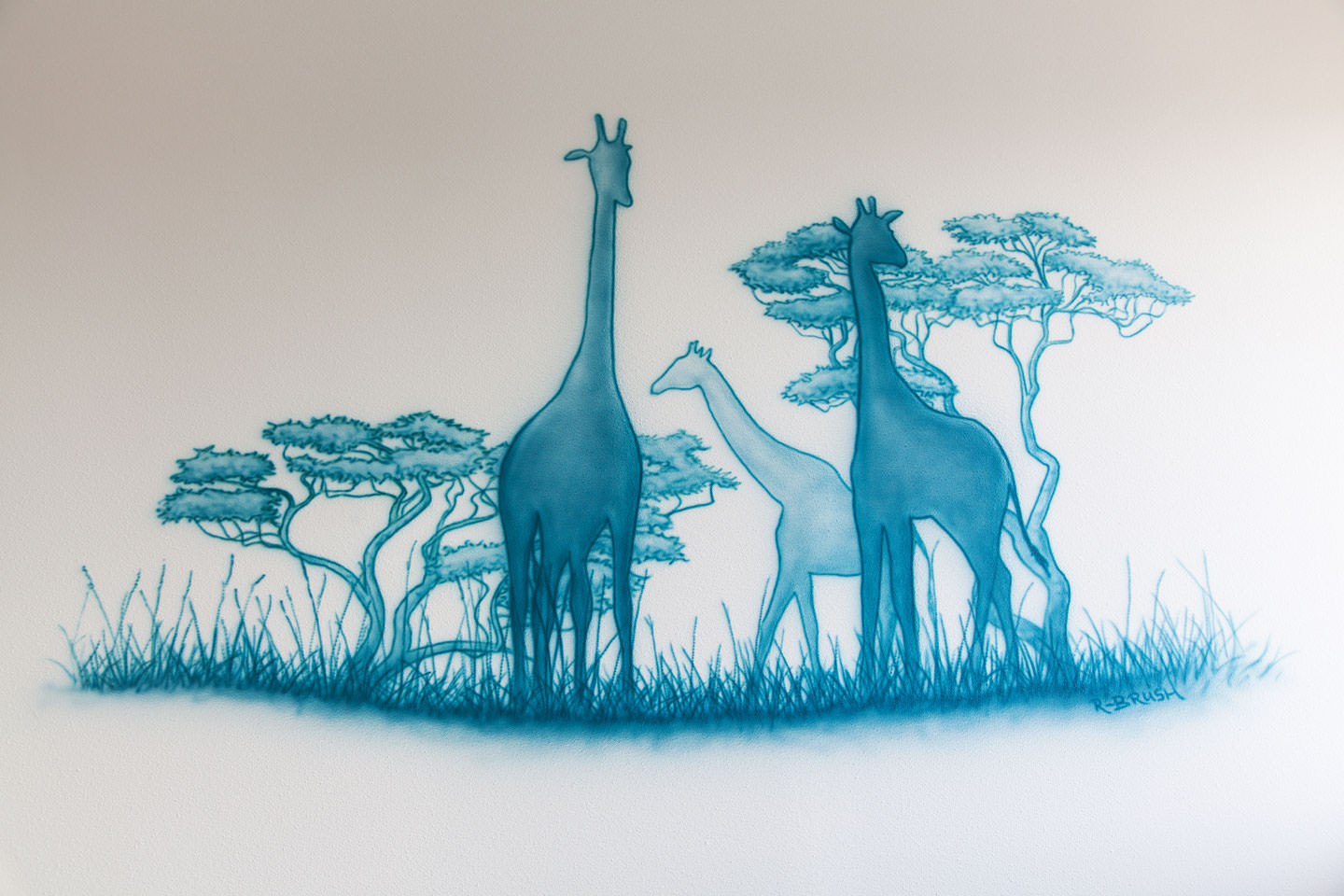 Safari silhouetten muurschildering met giraffen in een jongenskamer